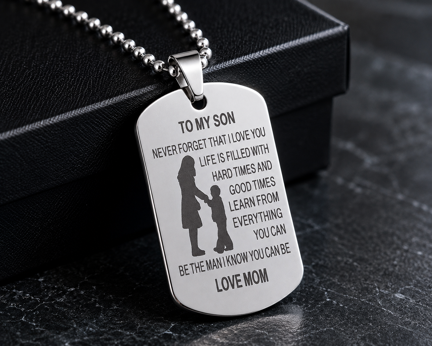 Dog tag necklace for son featuring heartfelt message from mom and silhouette artwork.
