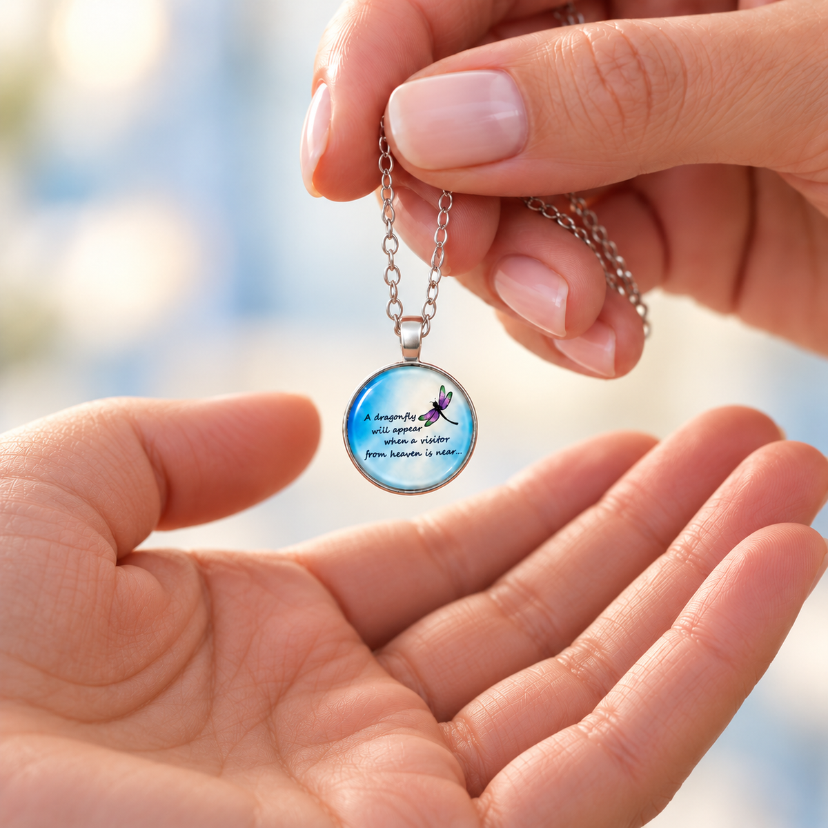 image of a round cabochon necklace featuring a dragonfly and a remembrance message