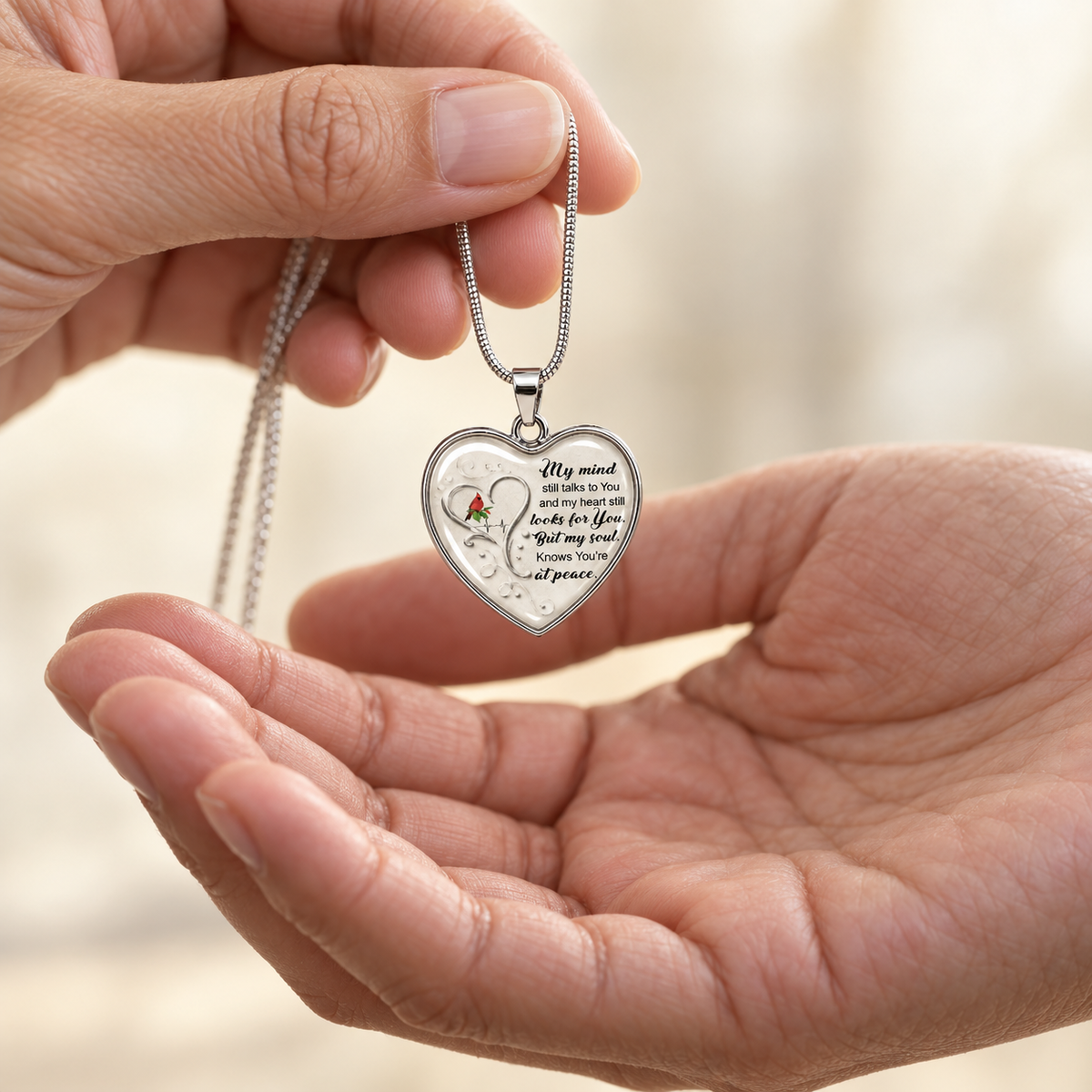 Heart-shaped memorial necklace with a red rose and My Mind Still Talks to You remembrance message
