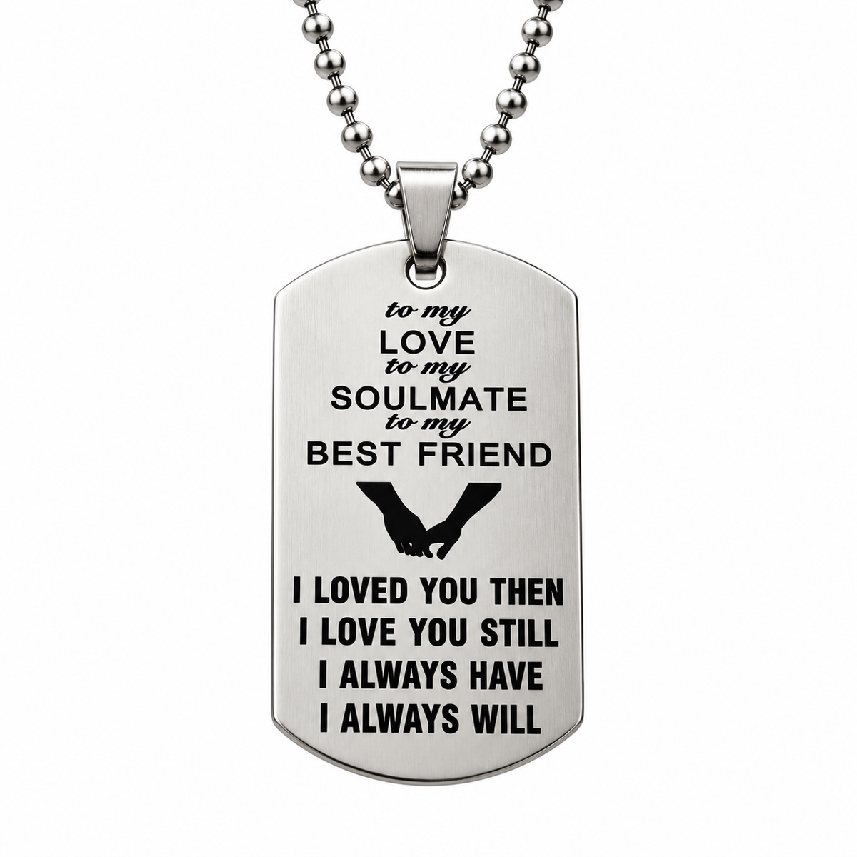 A silver-toned metal dog tag necklace with engraved black text and a silhouette of two hands holding, hanging from a silver ball chain on a plain white background.