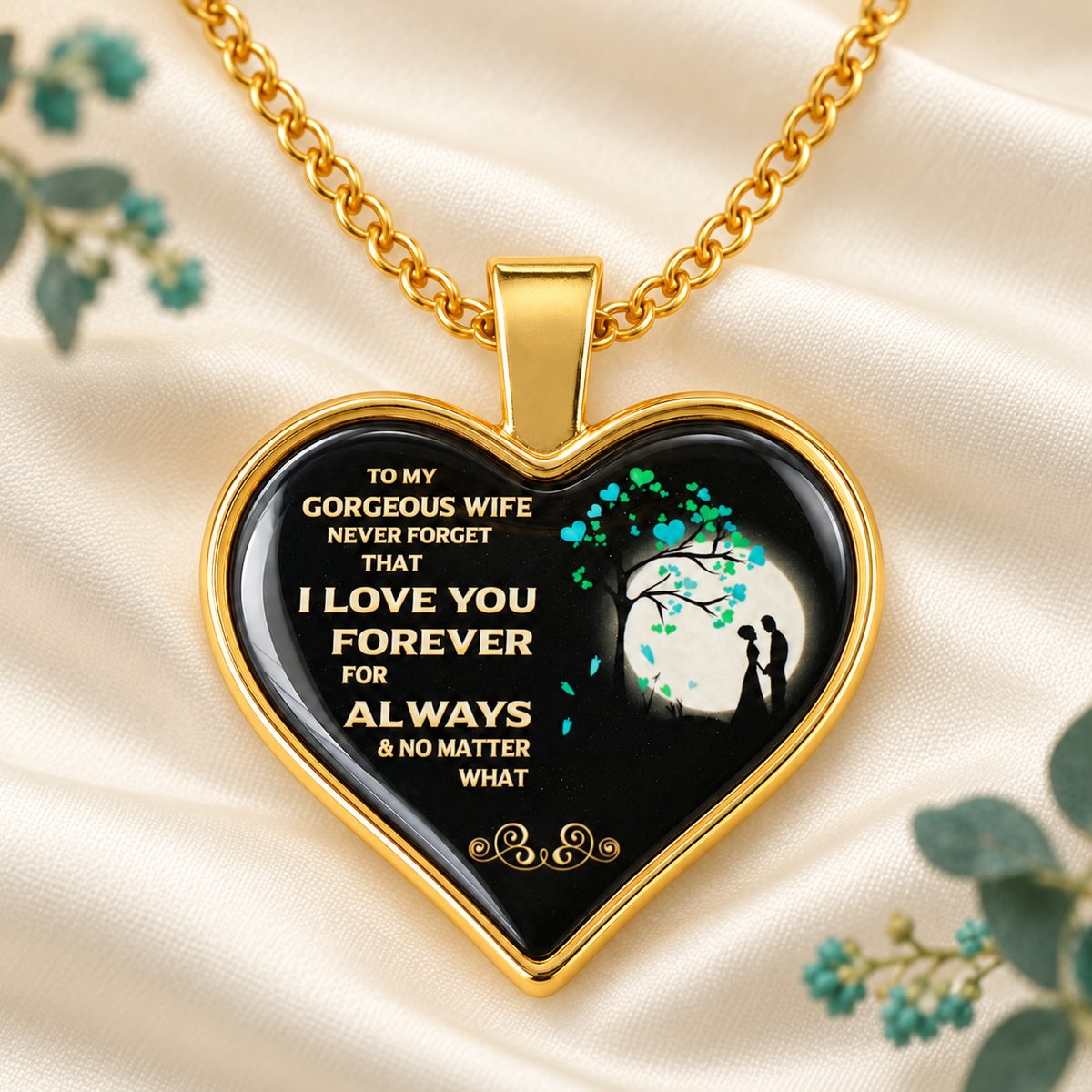 Gold heart necklace for wife displayed on ivory fabric with teal accents